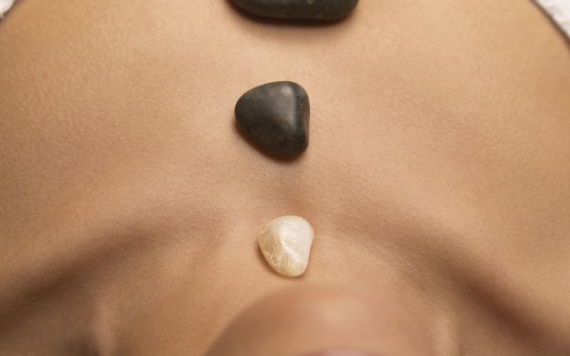 Woman meditating with crystals